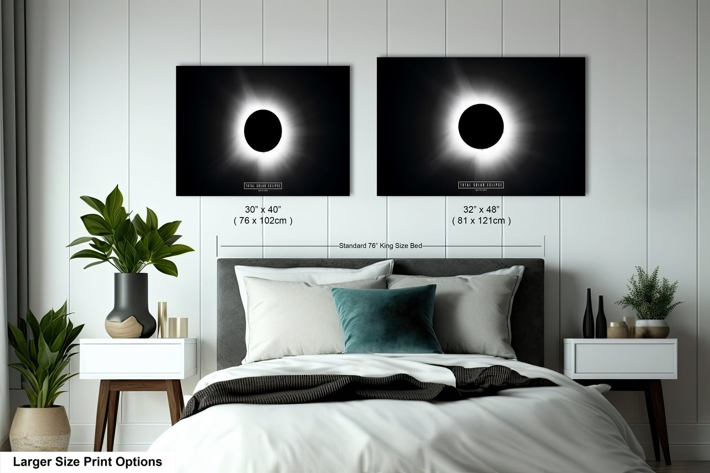 a bed with a white comforter and two black and white pictures on the wall