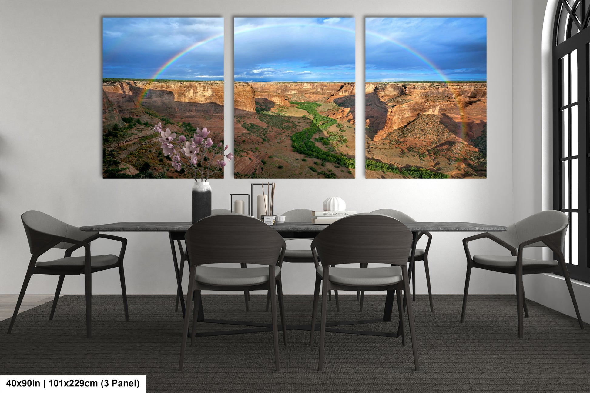 a dining room table with four chairs and a rainbow in the sky