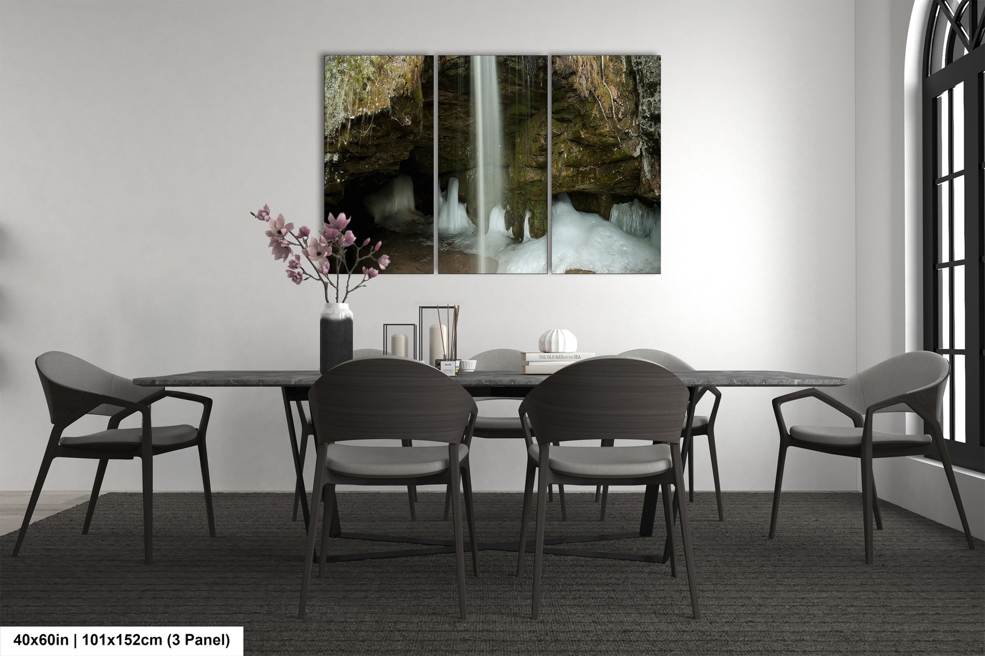 a dining room table with chairs and a waterfall