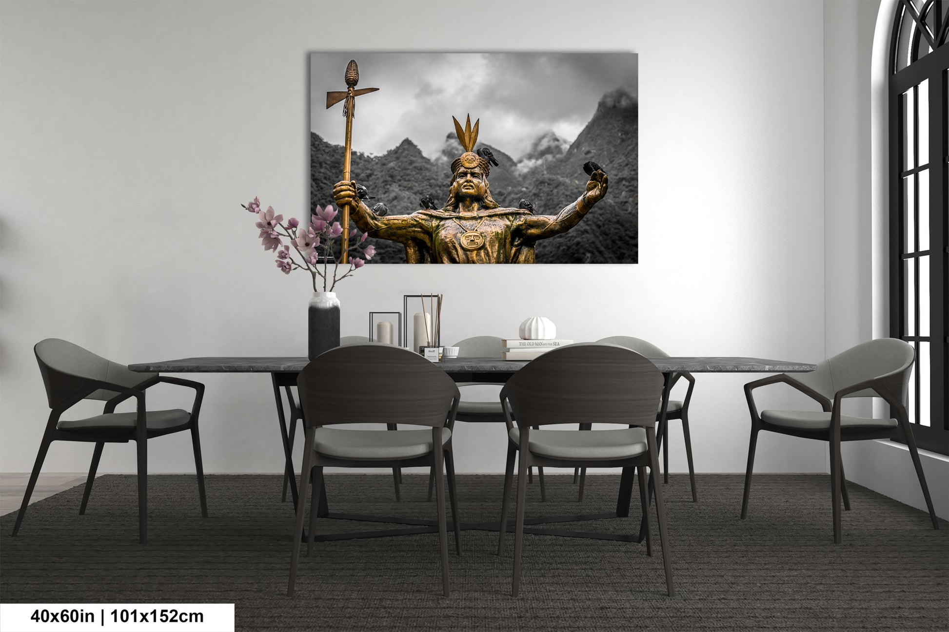a dining room table with chairs and a painting on the wall