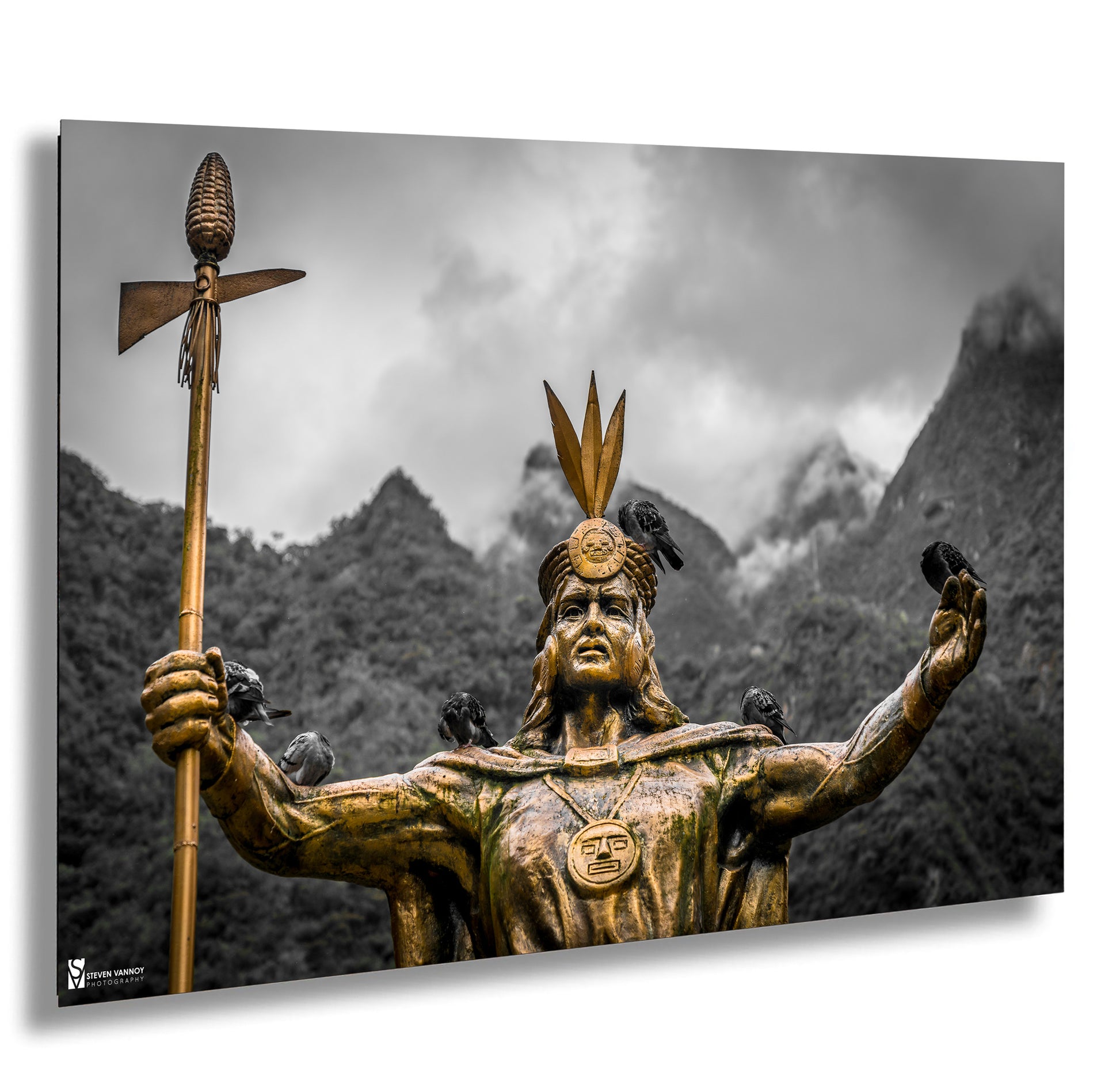 a statue of a native american holding a spear