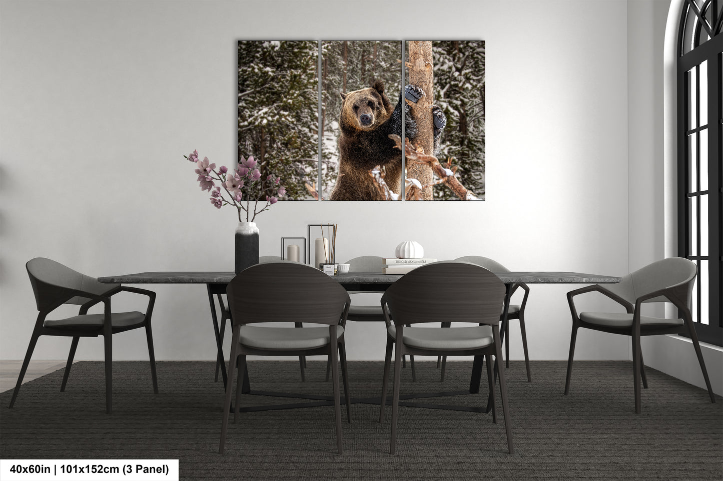 a dining room table with chairs and a picture of a dog hanging on the wall