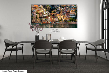 a dining room table with chairs and a painting on the wall