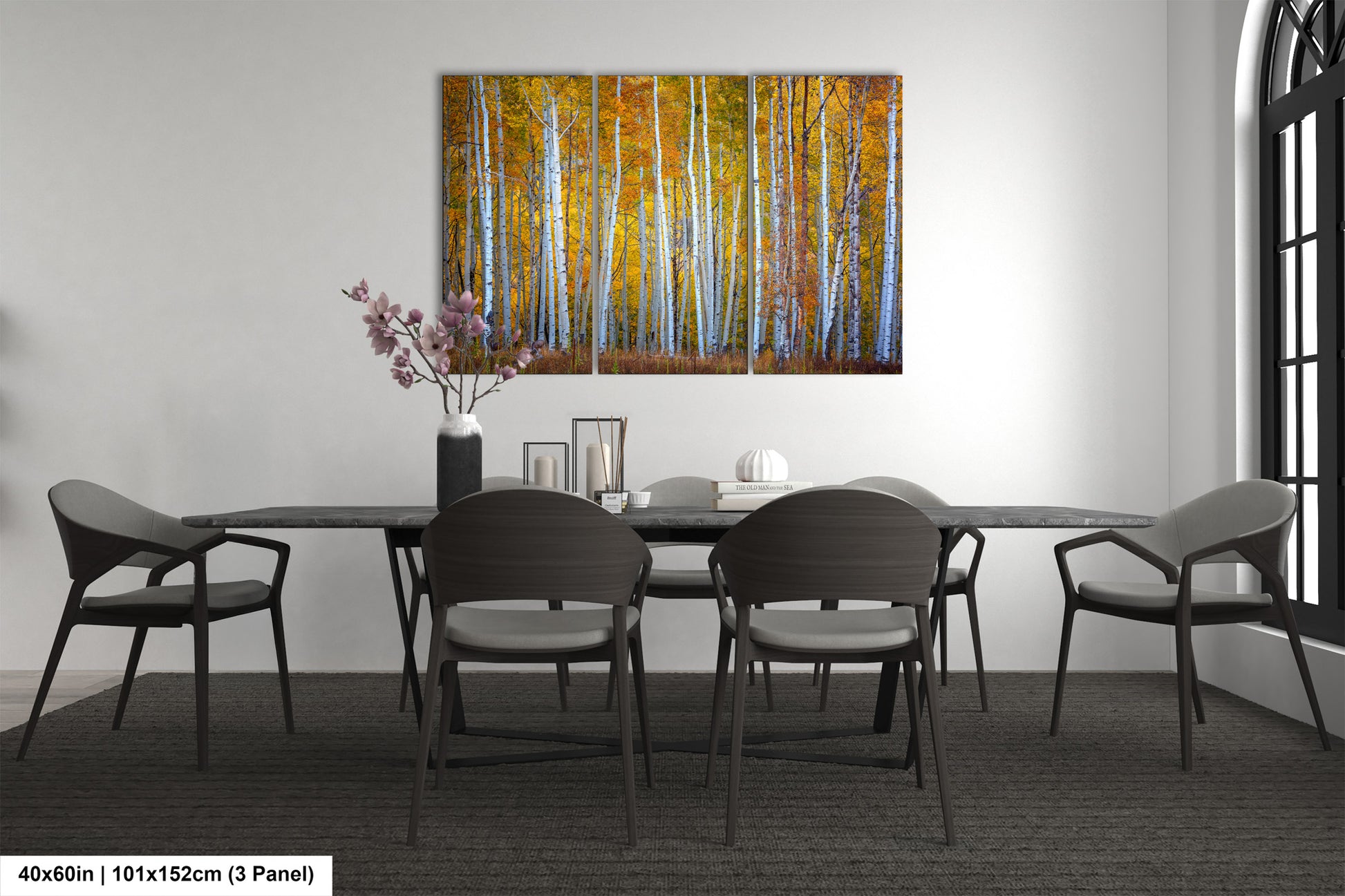 a dining room table with chairs and a painting on the wall
