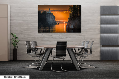 a dining room table with chairs and a painting on the wall