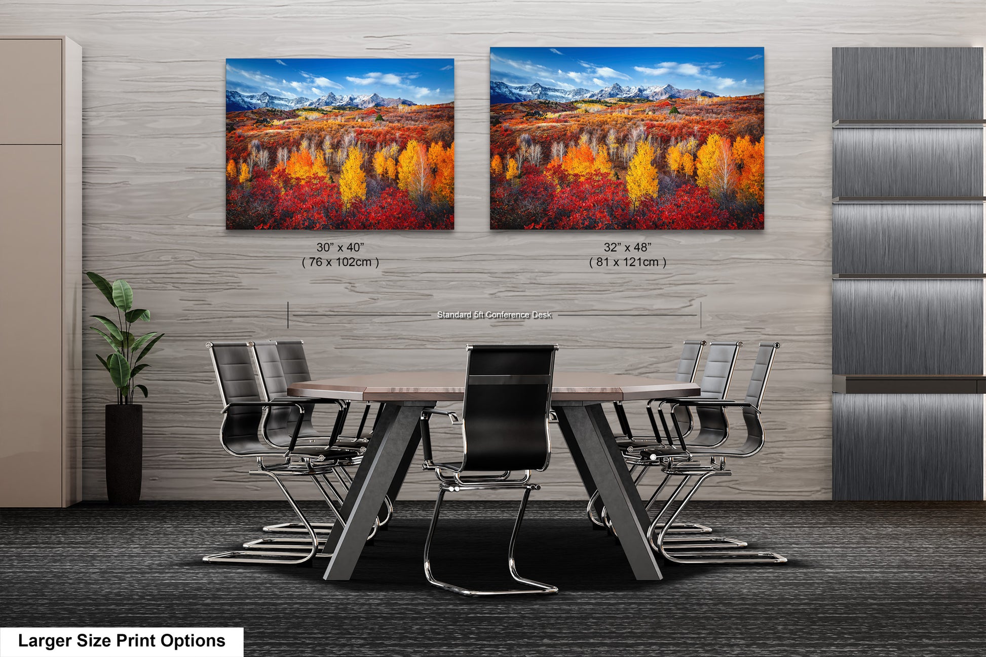 a dining room table with chairs and two paintings on the wall