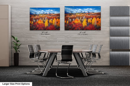 a dining room table with chairs and two paintings on the wall