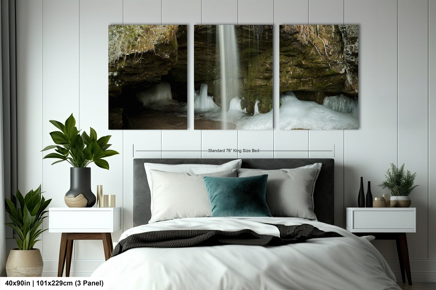 a bedroom with a bed and two paintings on the wall