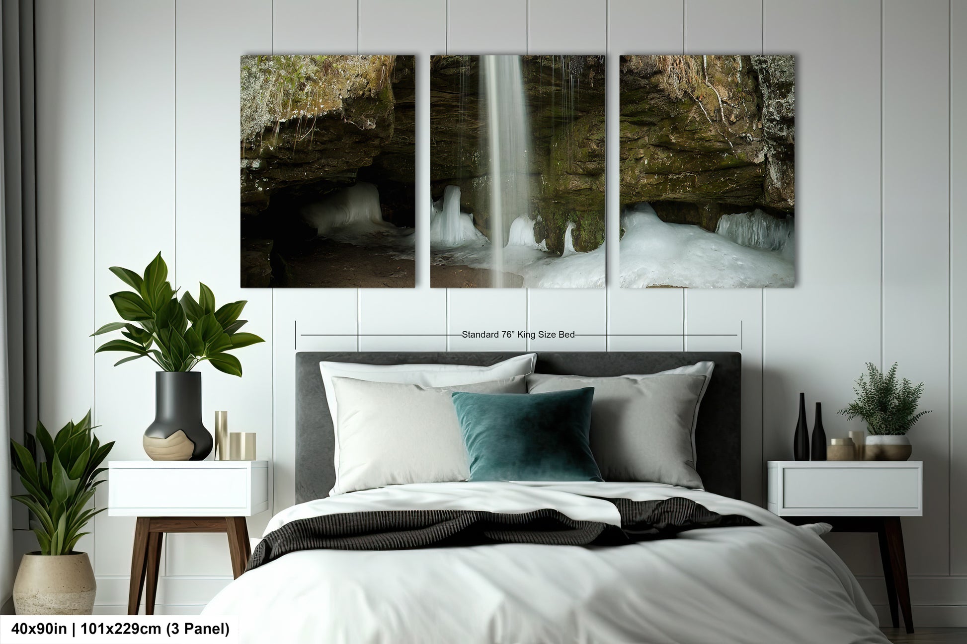 a bedroom with a bed and two paintings on the wall