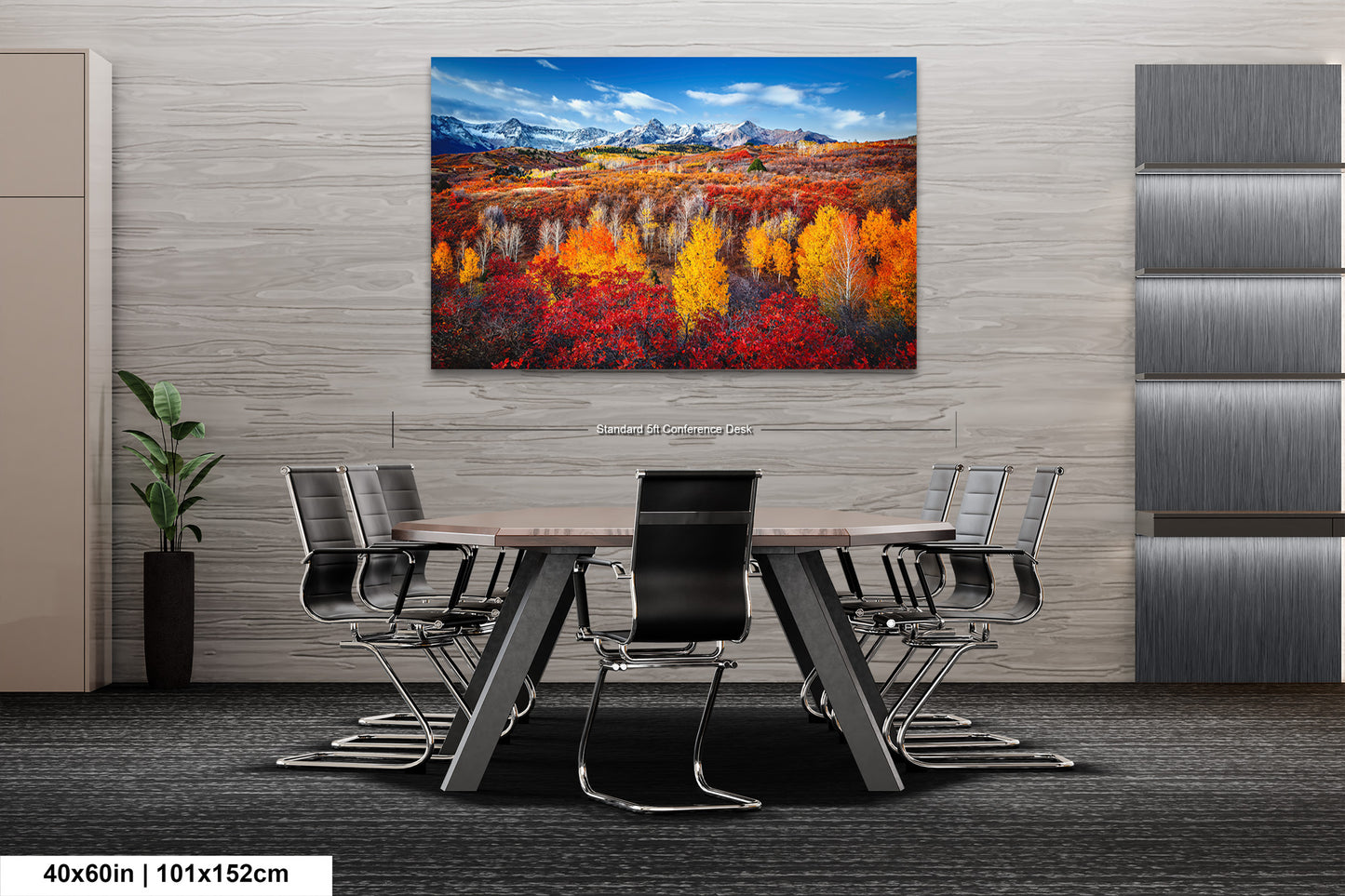 a dining room table with a painting on the wall