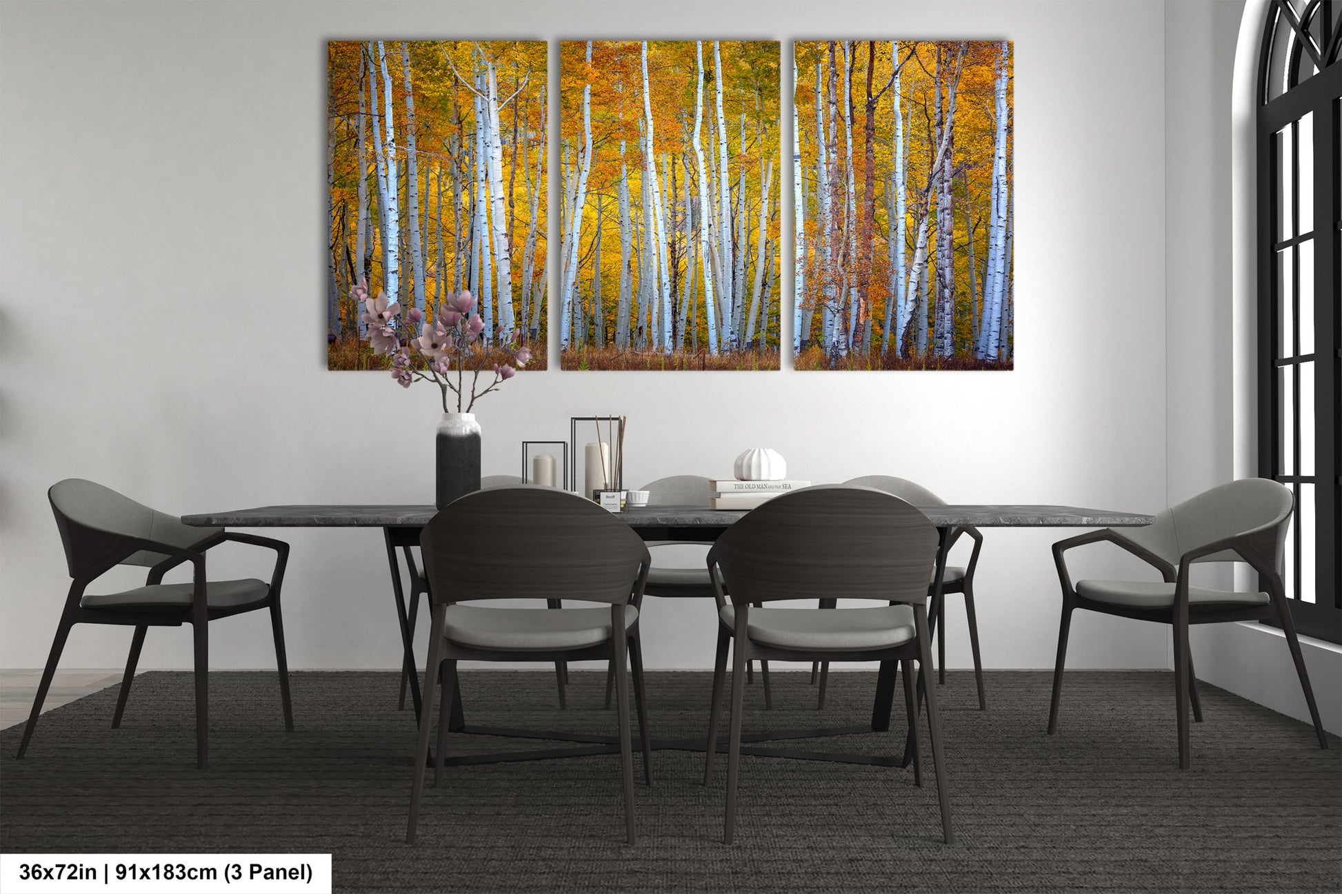 a dining room table with chairs and a painting on the wall
