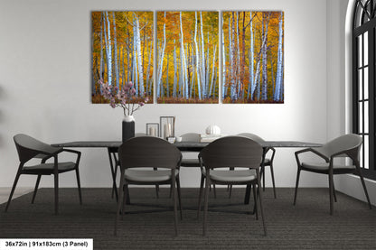 a dining room table with chairs and a painting on the wall