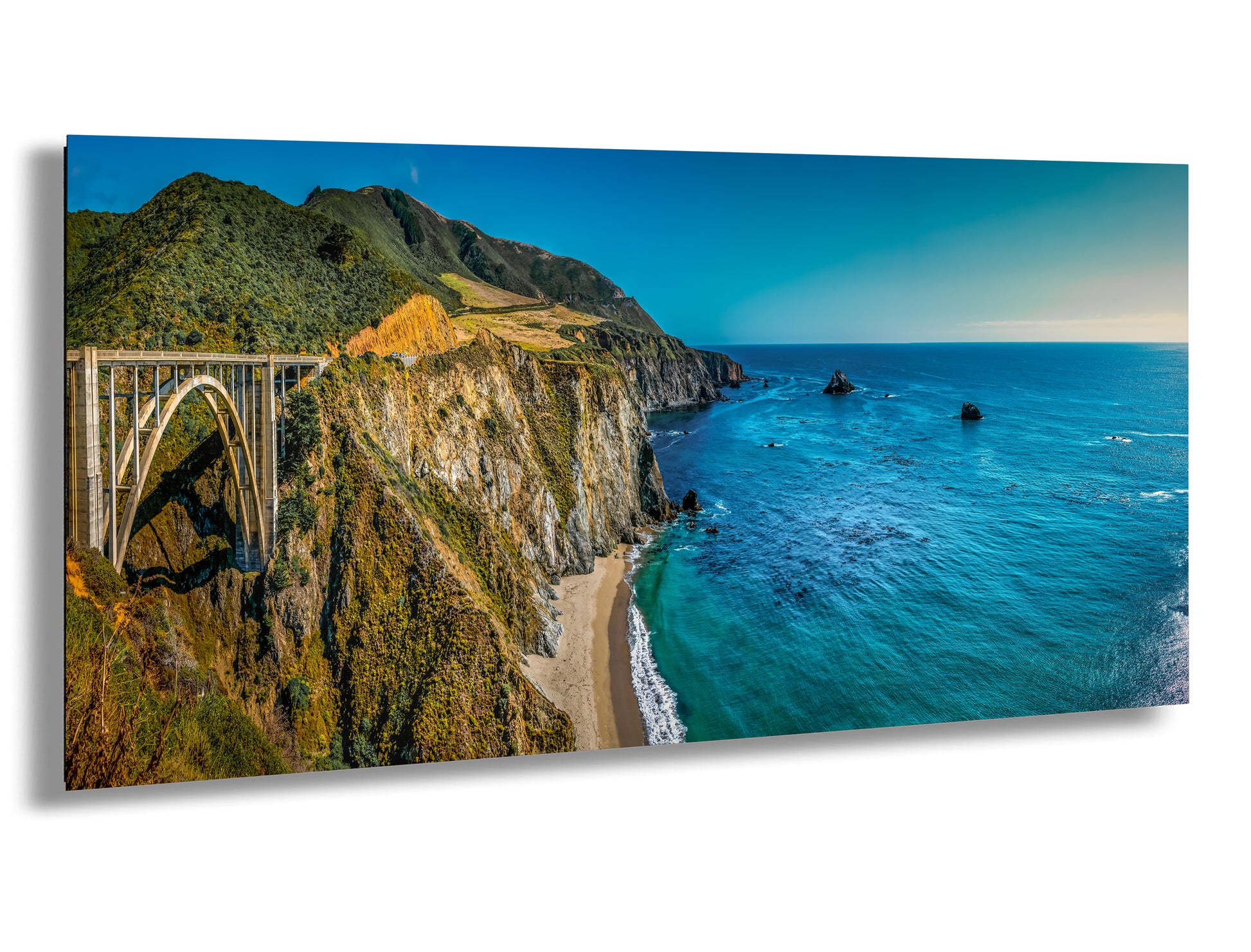 a scenic view of a bridge over a body of water