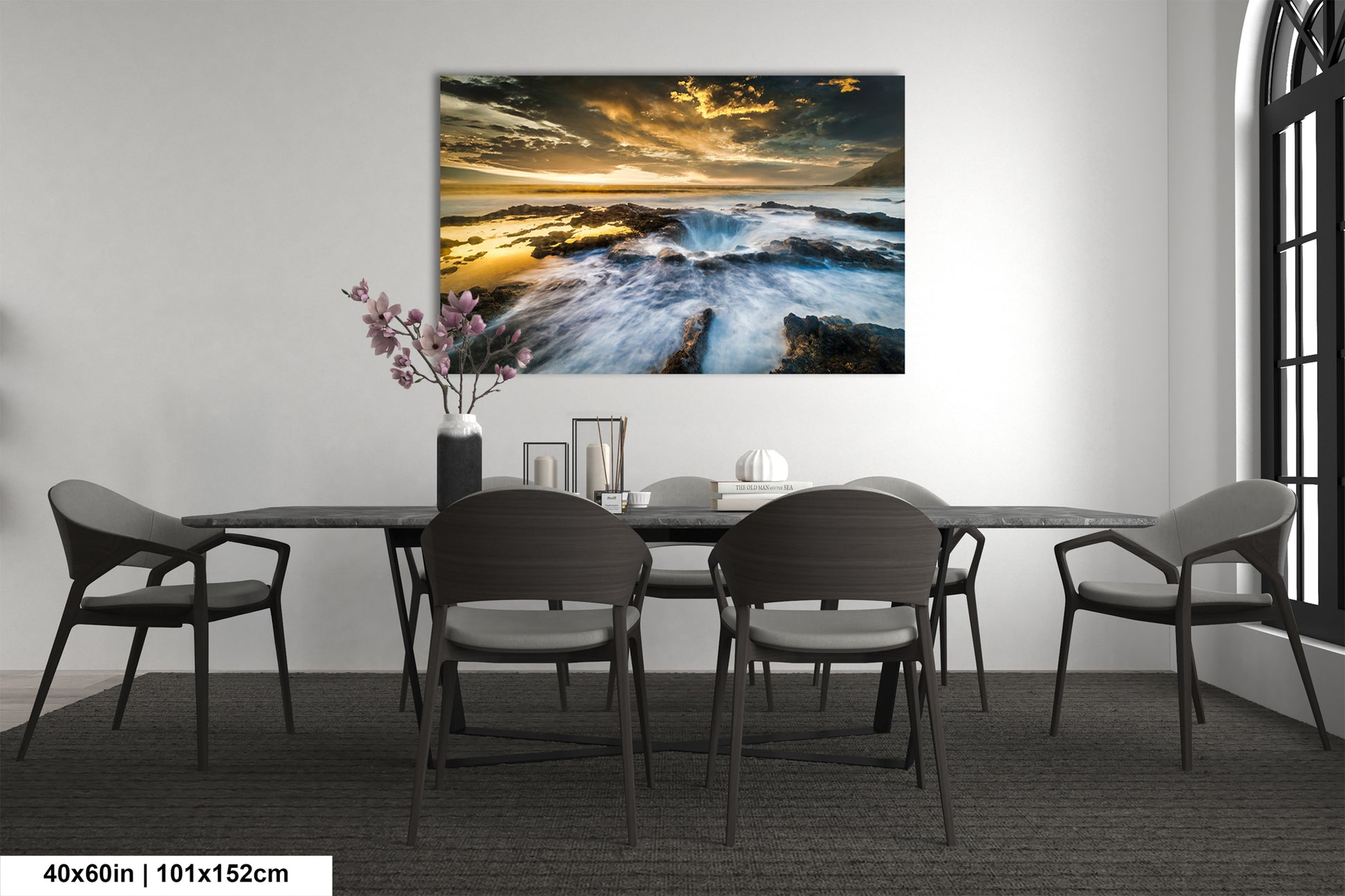 a dining room table with chairs and a painting on the wall