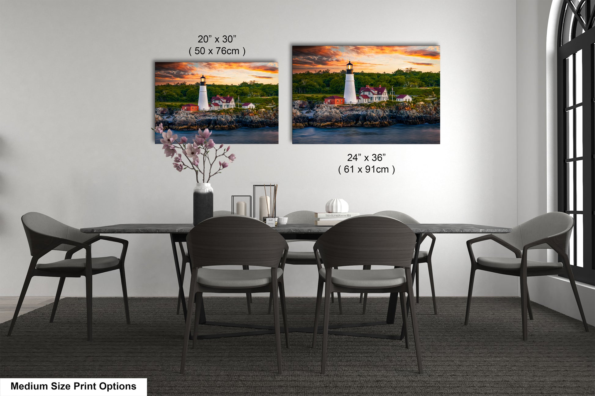 a dining room table with four chairs and a picture of a lighthouse