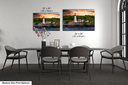 a dining room table with four chairs and a picture of a lighthouse