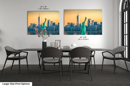 a dining room table with four chairs and a picture of the statue of liberty