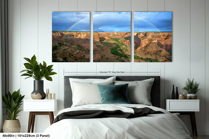 a bed room with a neatly made bed and two pictures on the wall
