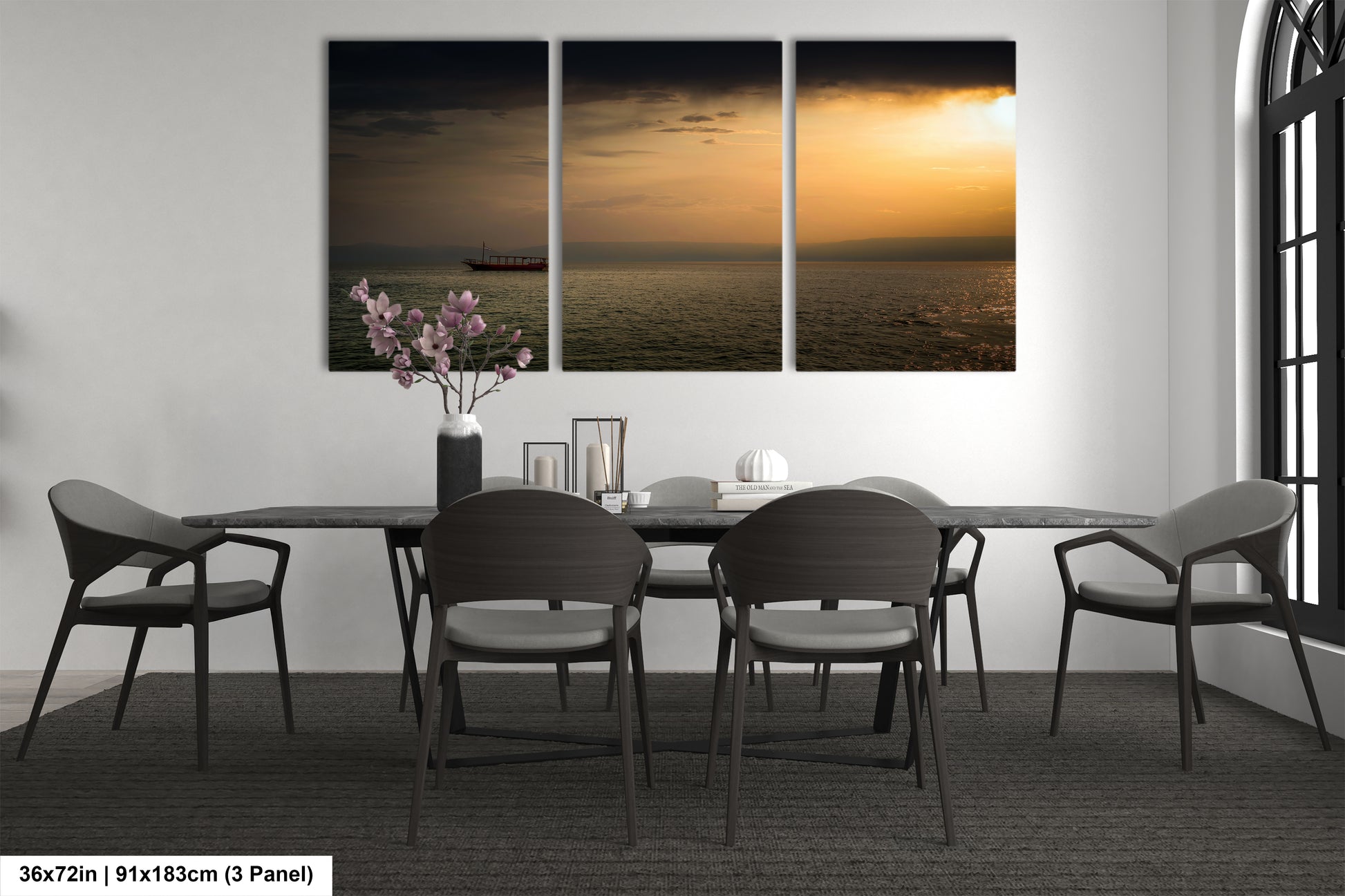 a dining room table with chairs and a vase of flowers