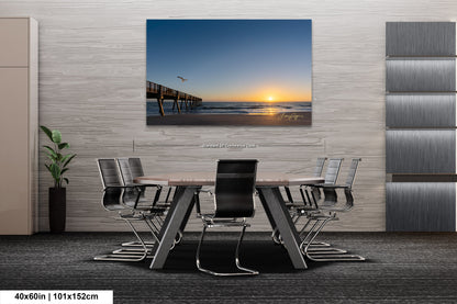 a dining room table with a view of the ocean