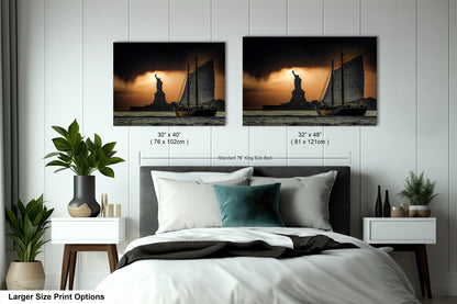 a bed with two pictures on the wall above it