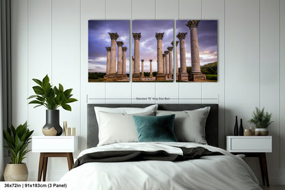 a bed room with a neatly made bed and a painting on the wall