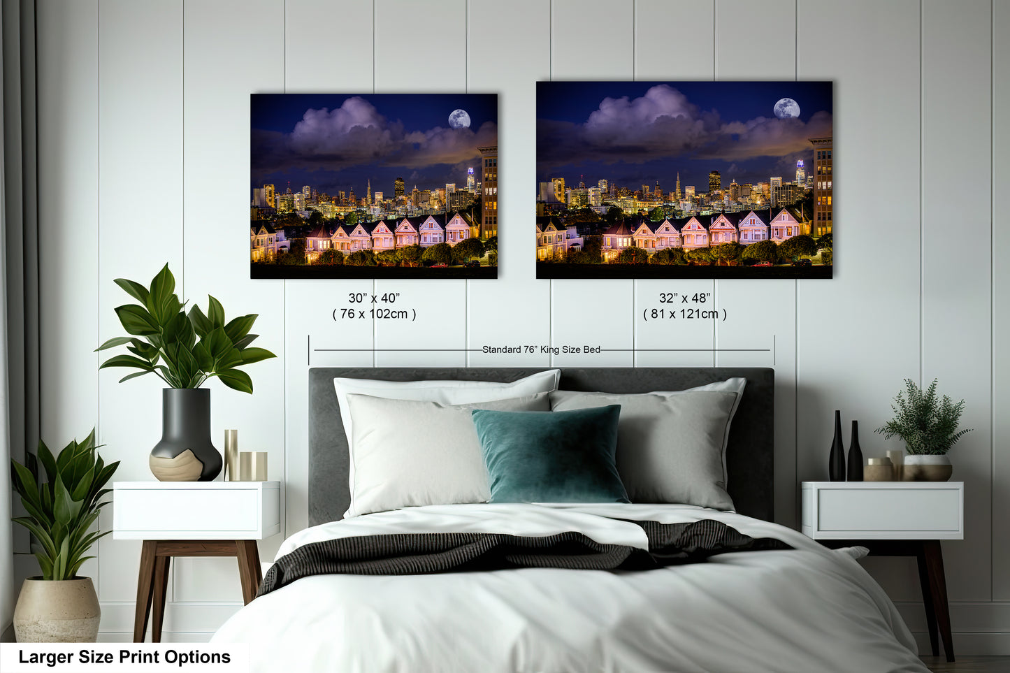 a bed with two pictures of a city at night