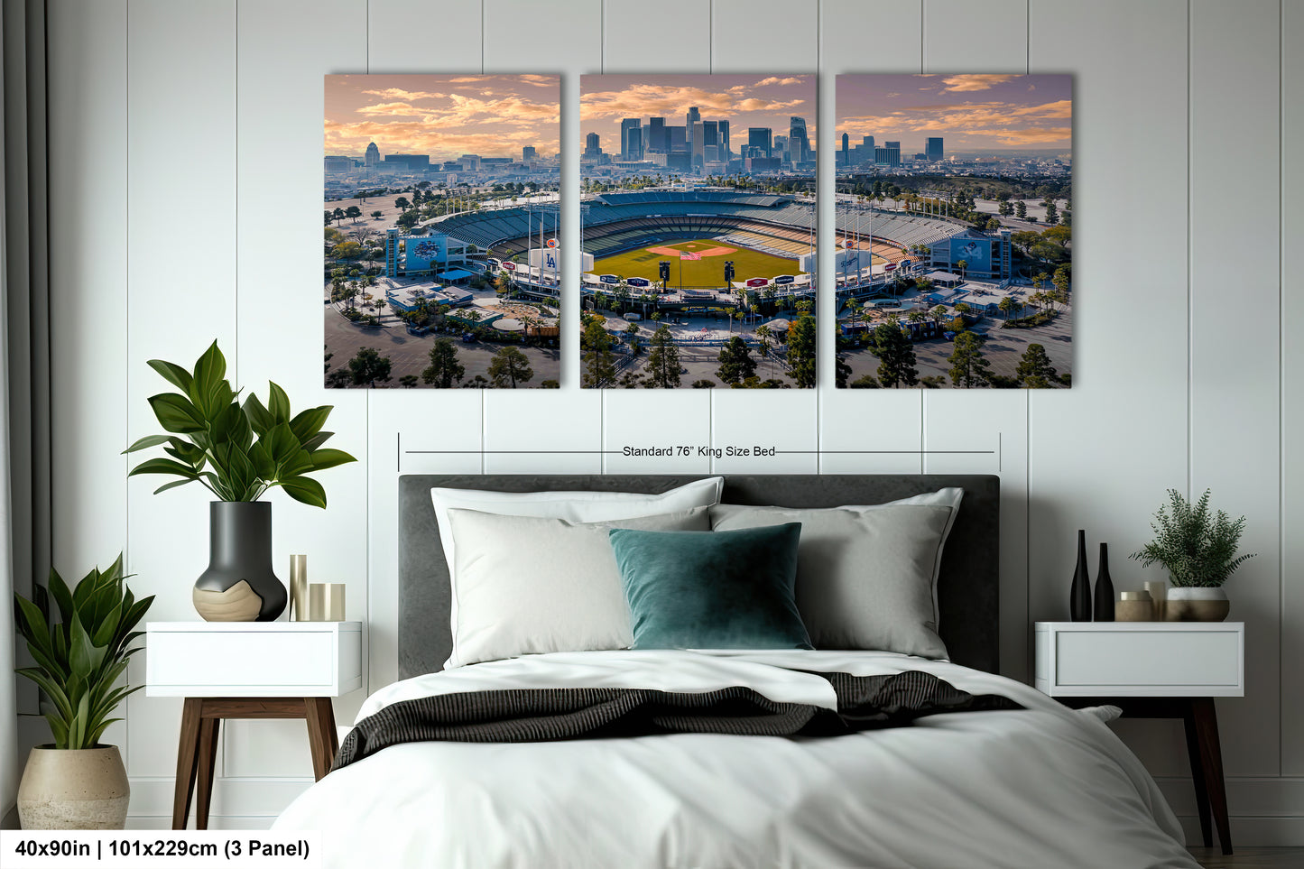 a bedroom with a large bed and two pictures on the wall