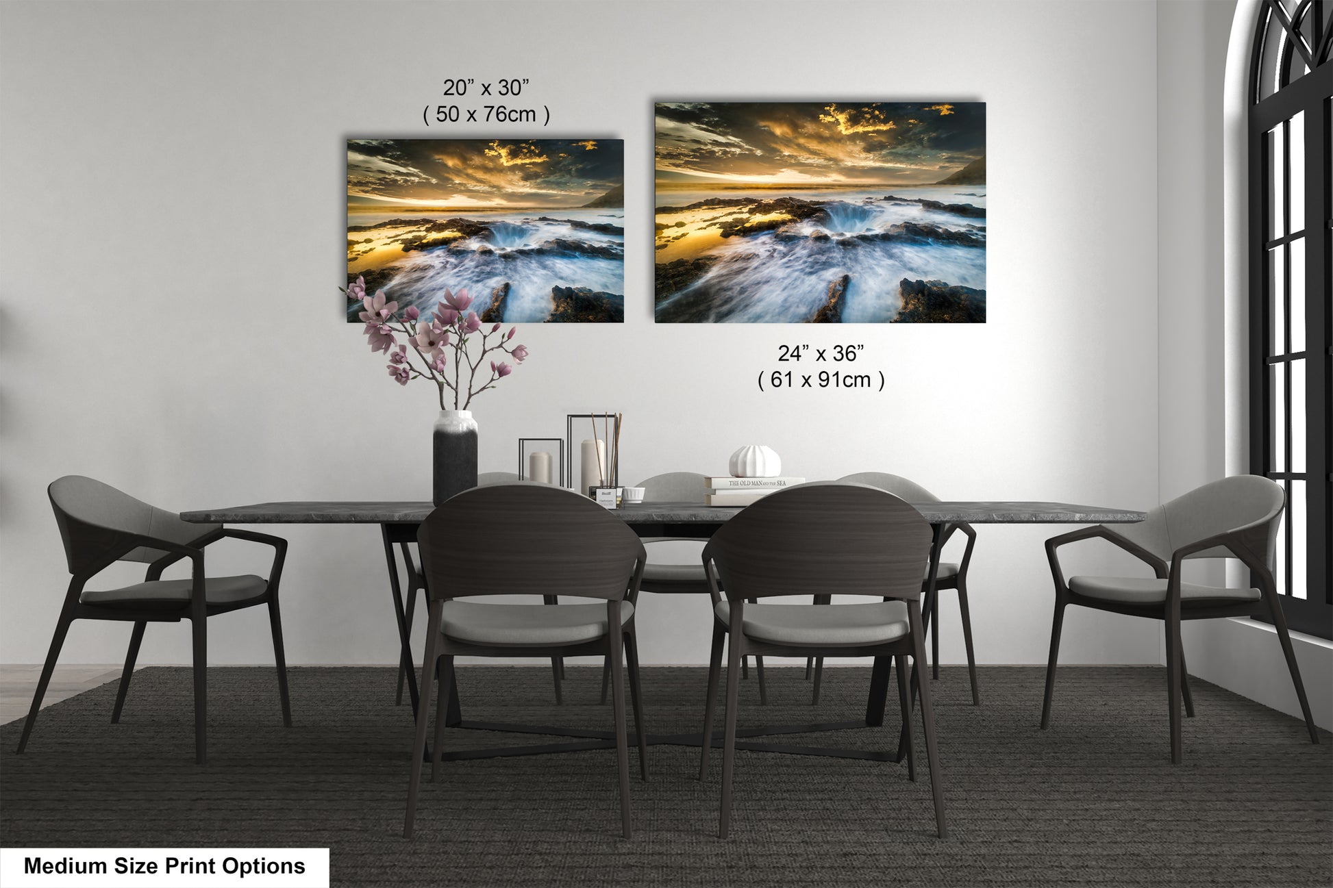 a dining room table with four chairs and a vase of flowers