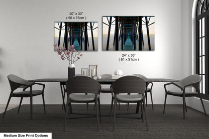 a dining table with four chairs and a vase with flowers