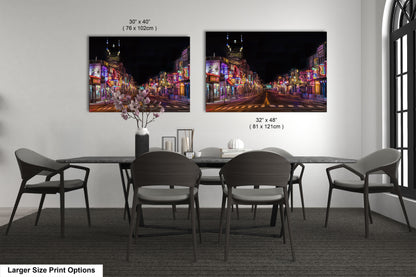 a dining table with four chairs and a vase with flowers