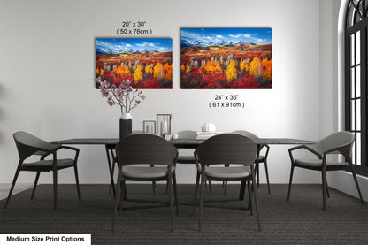 a dining room table with four chairs and two paintings on the wall