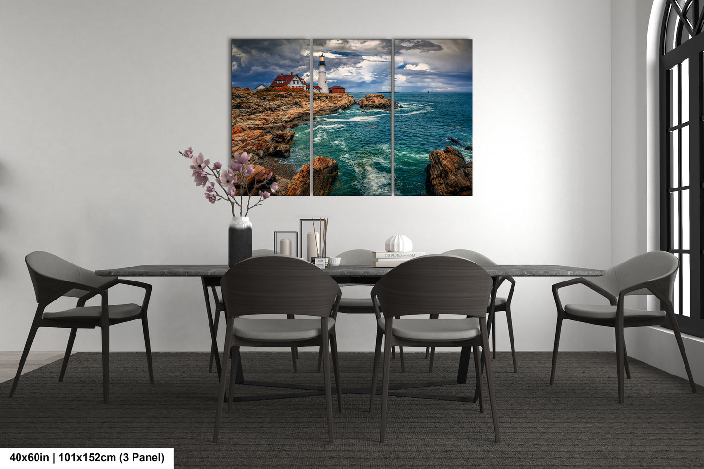 a dining room table with chairs and a painting on the wall