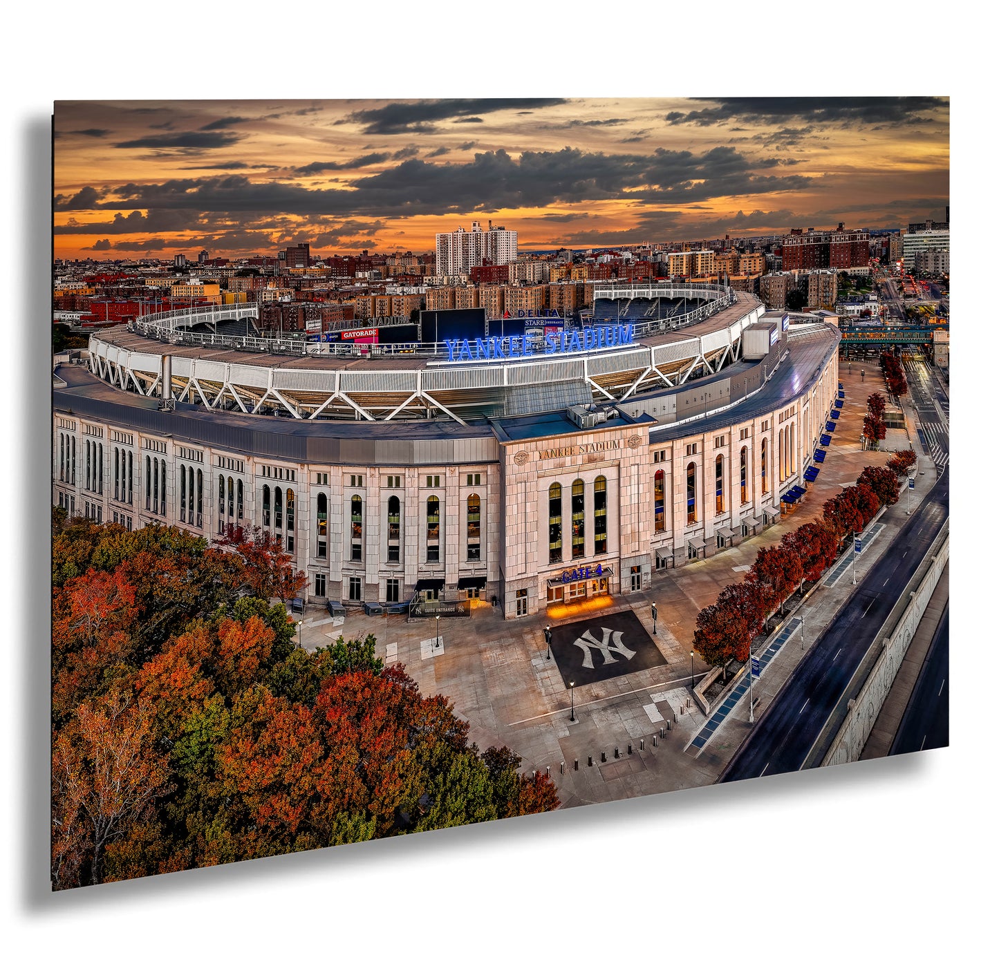 an aerial view of a baseball stadium at sunset