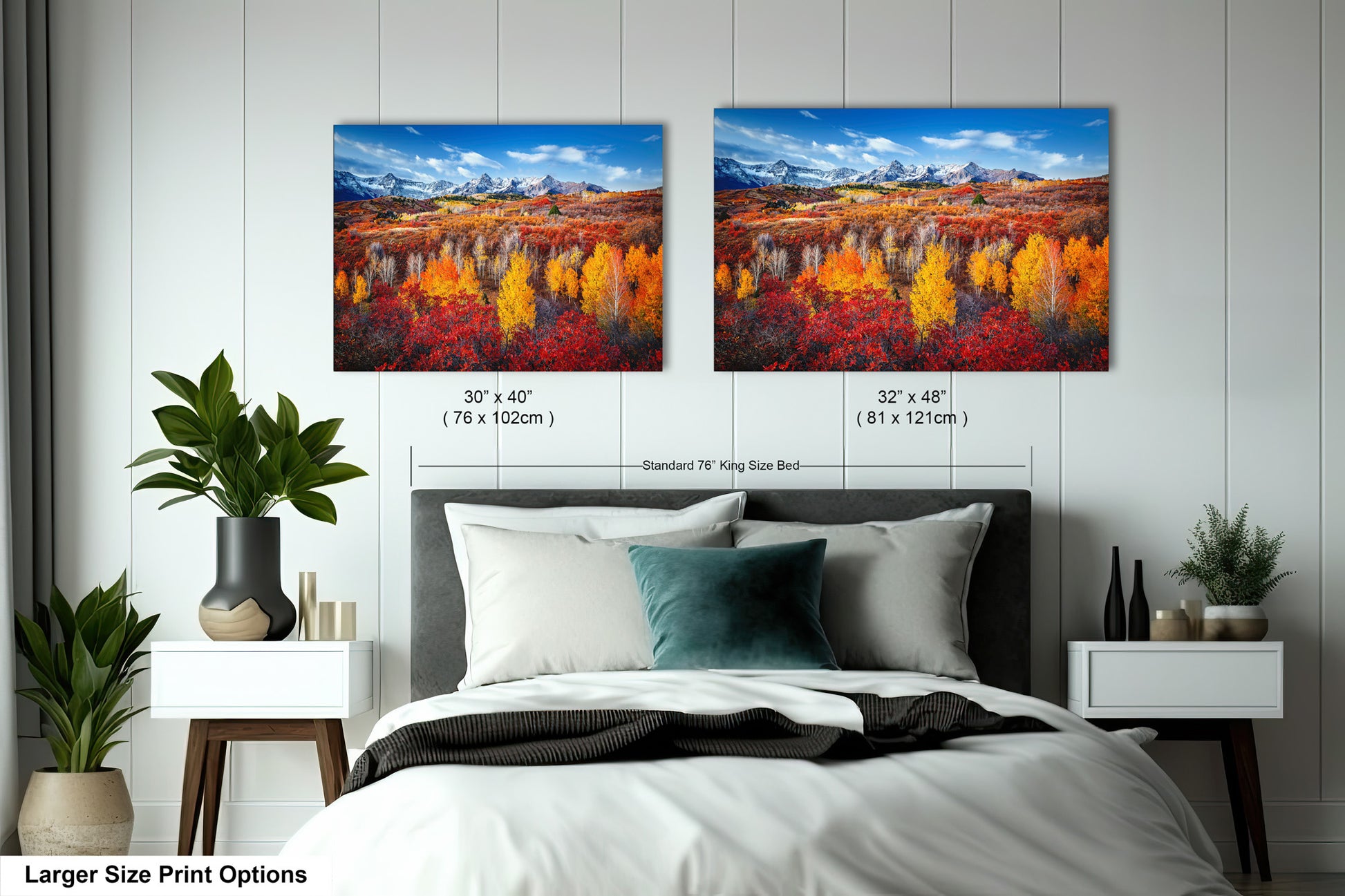 a bedroom with a bed and two paintings on the wall