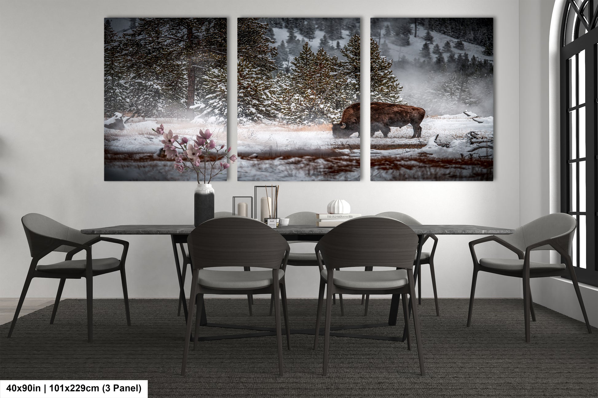 a dining room table with four chairs and a painting on the wall