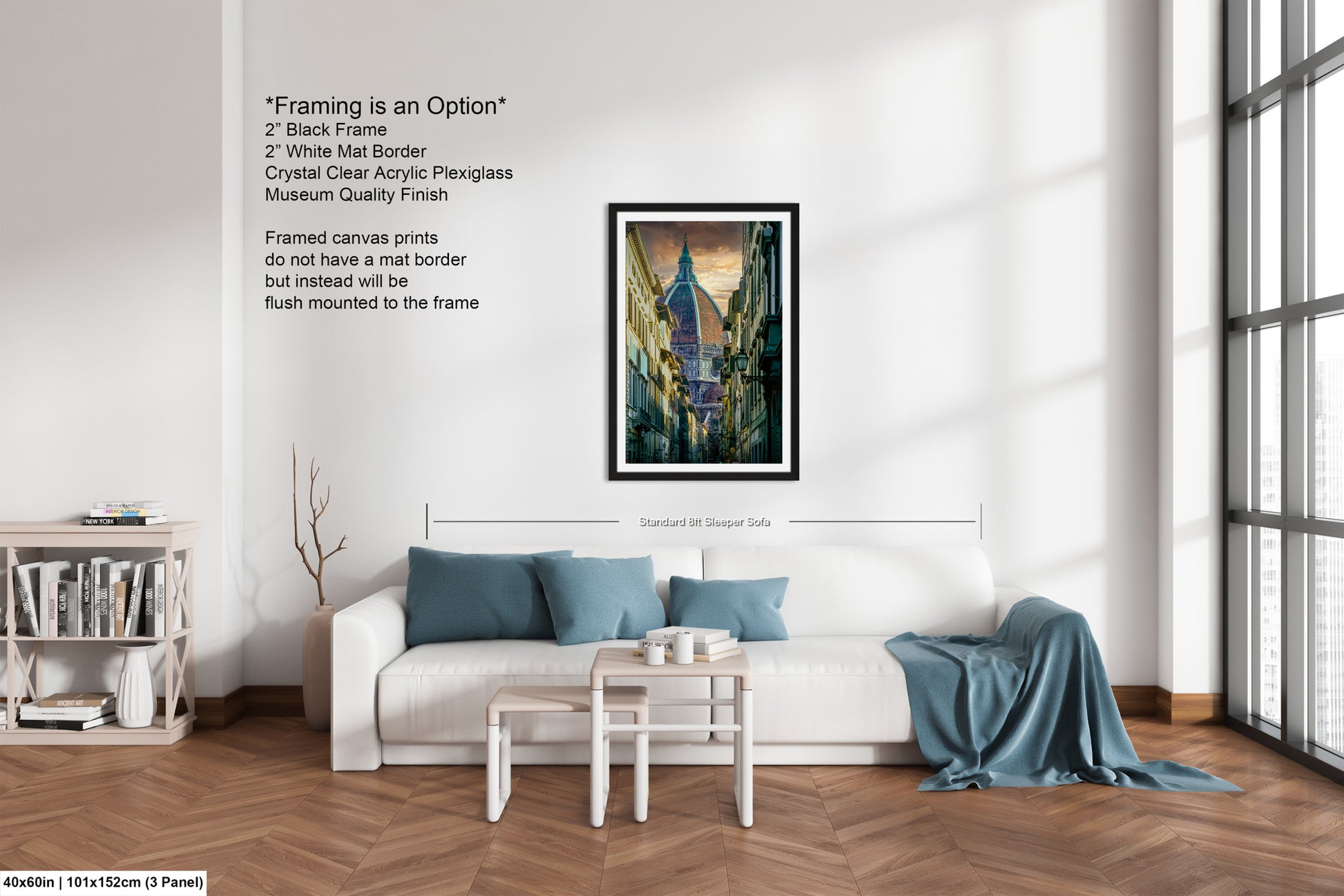 a living room with a white couch and a painting on the wall