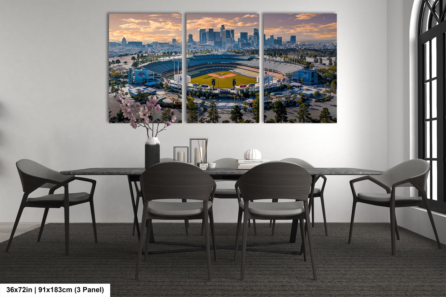 a dining room table with chairs and a view of a stadium