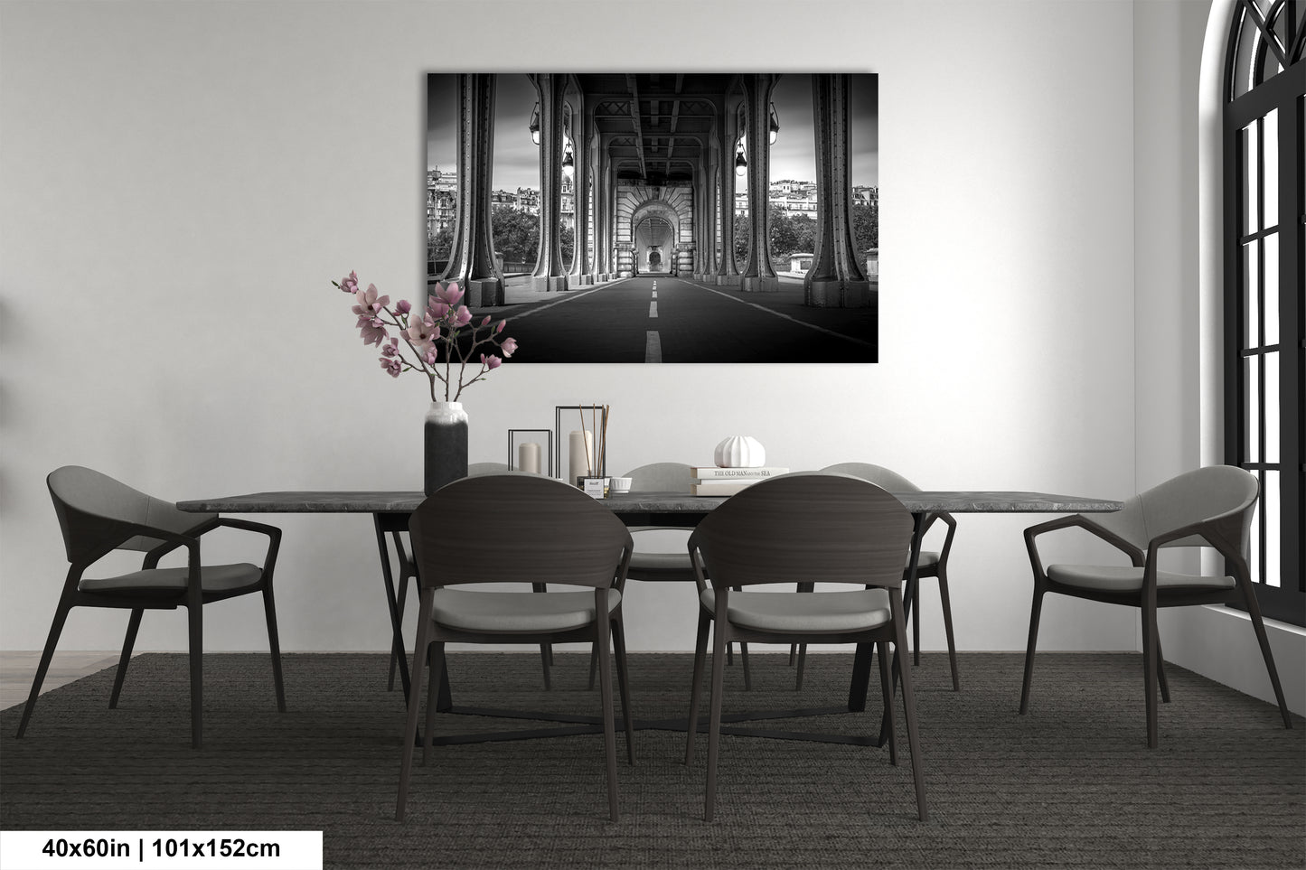 a black and white photo of a dining room table