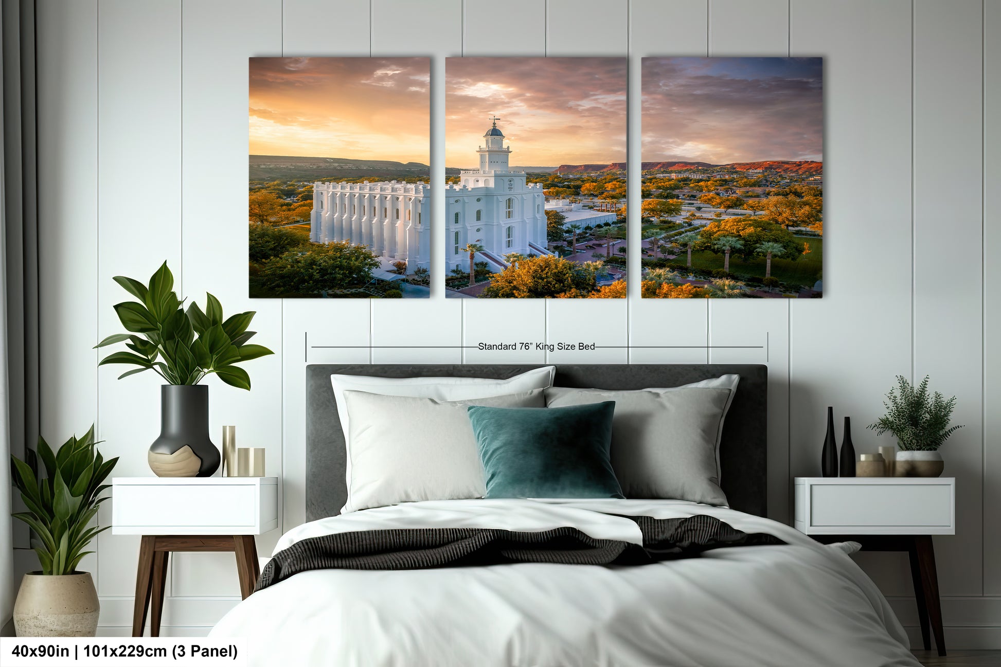 a bedroom with a large bed and two paintings on the wall