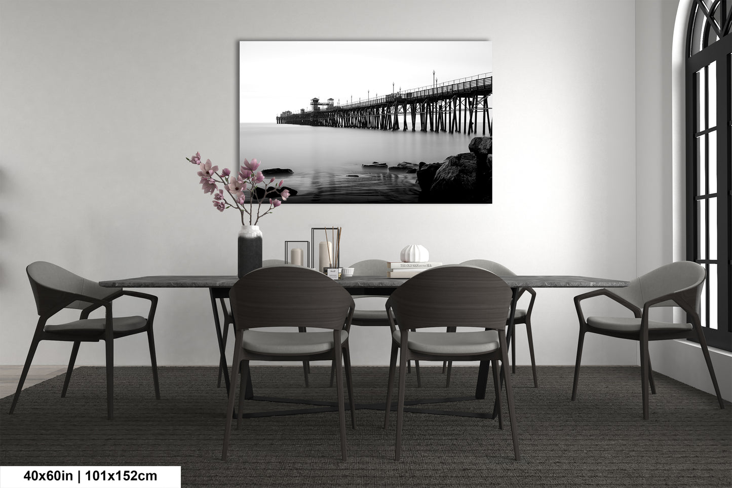 a black and white photo of a table and chairs