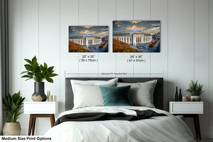 a bedroom with a bed and two pictures on the wall