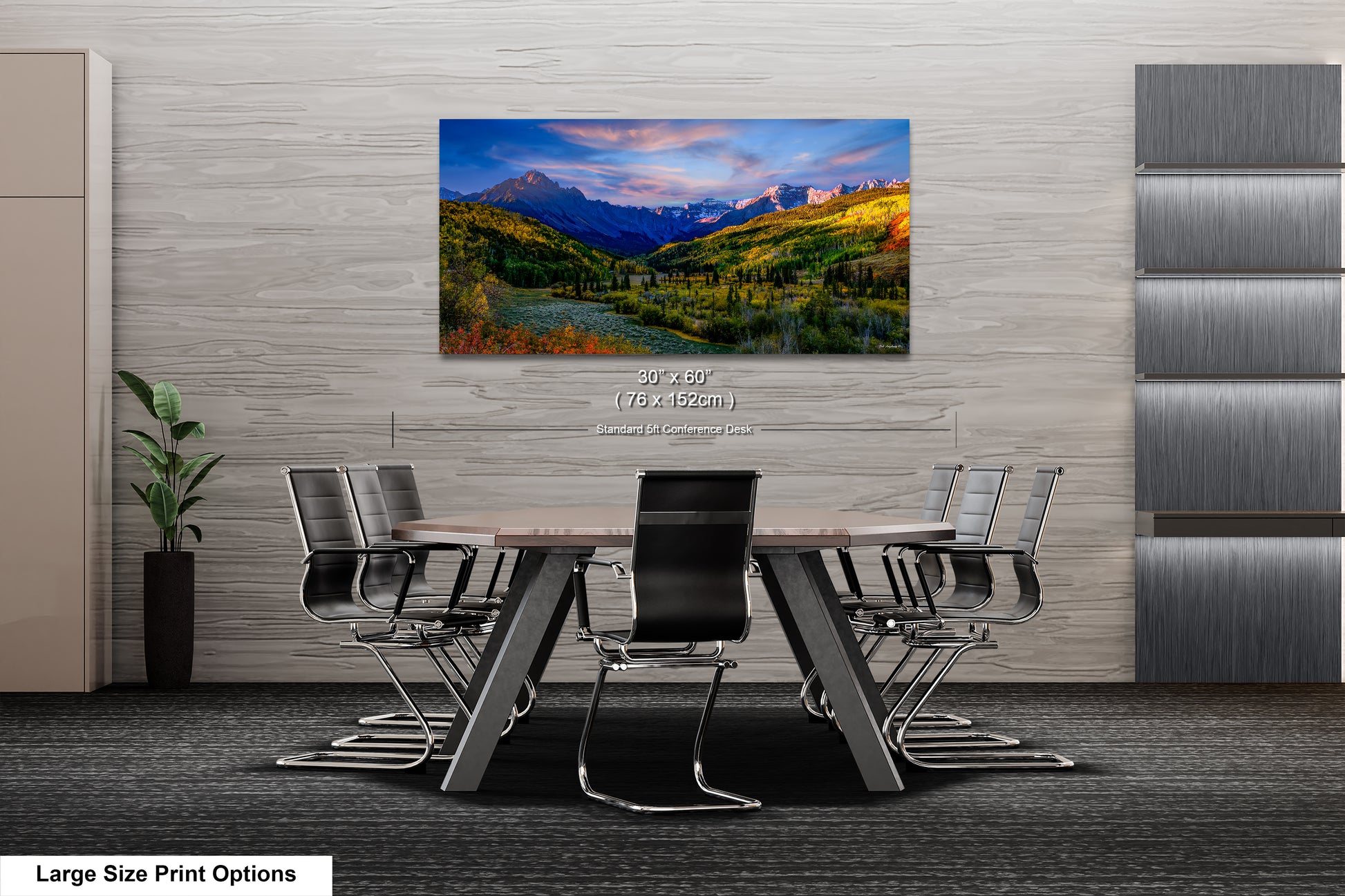 a dining room table with chairs and a painting on the wall