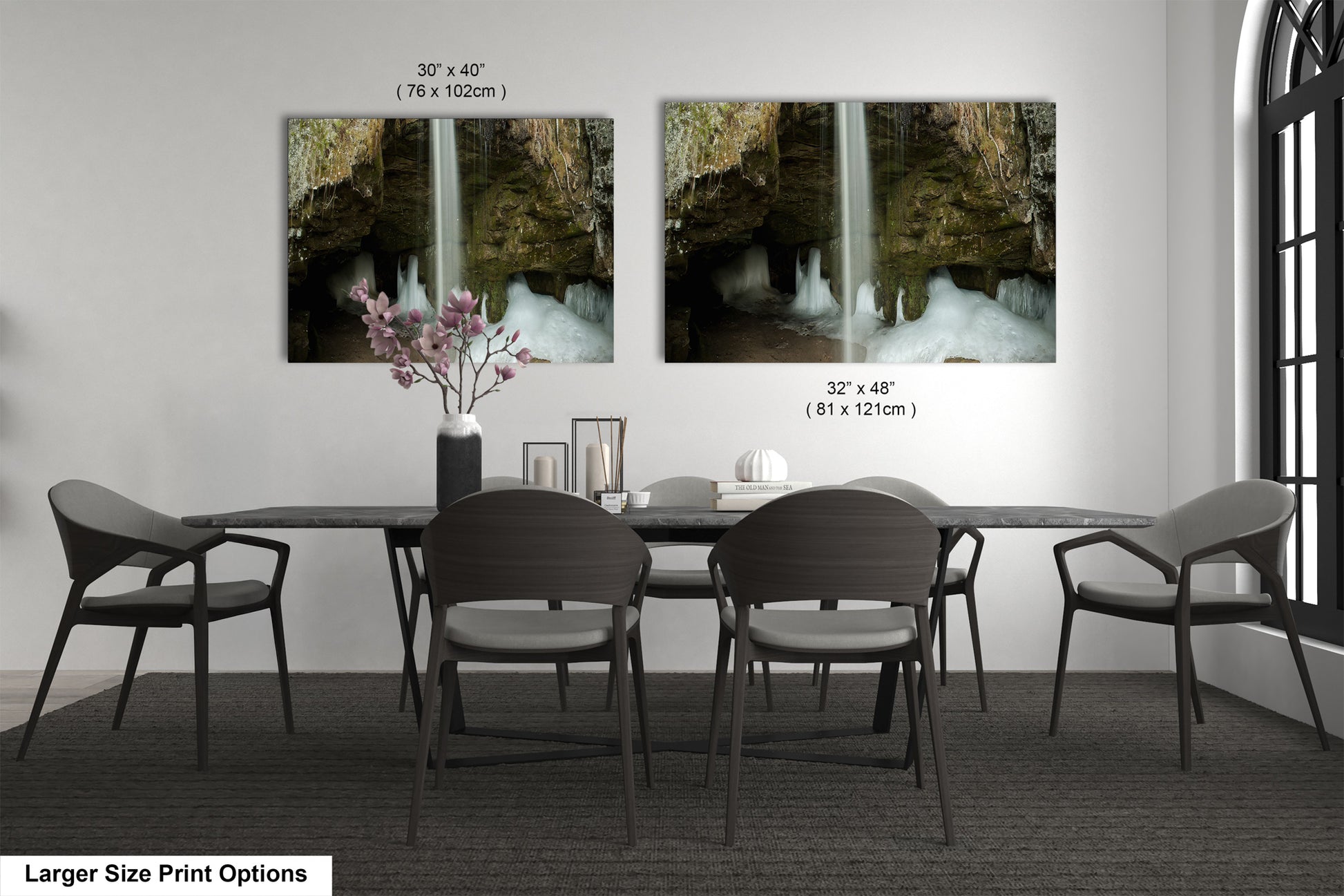 a dining room table with chairs and a vase of flowers