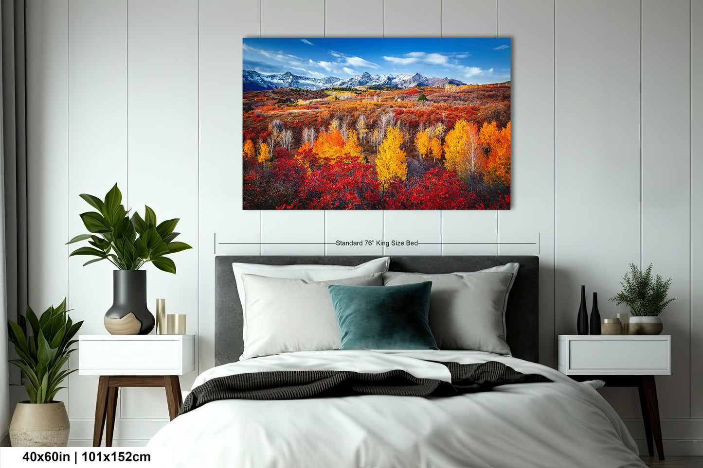 a bedroom with a bed and a painting on the wall