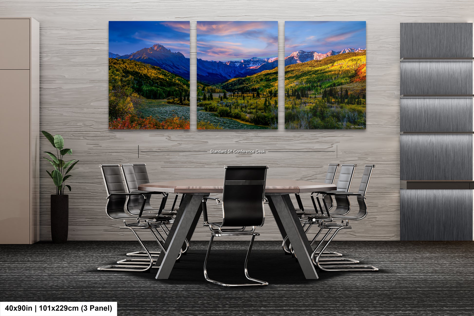 a dining room table with chairs and a painting on the wall