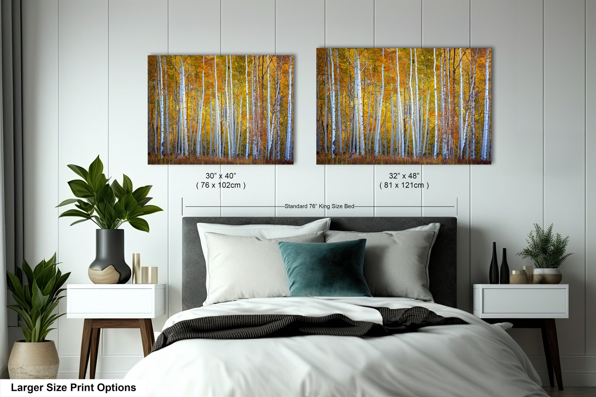 a bed with a white comforter and two paintings on the wall