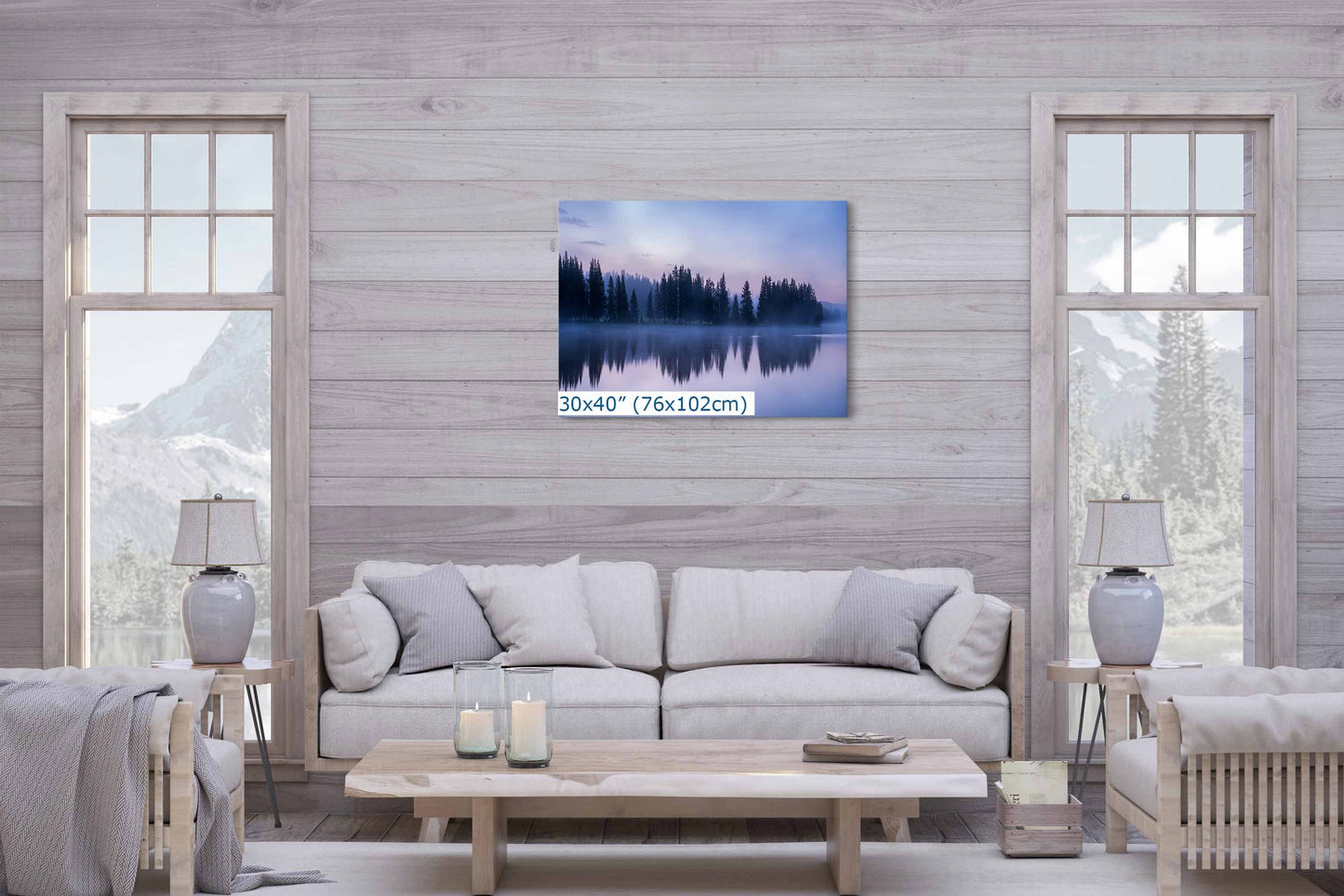 Large 30x40 wall art print of a tranquil twilight reflection scene at Yellowstone Lake, centered over a sofa, serving as a living room&#39;s focal point.