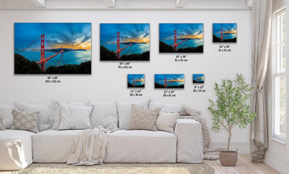 Wall art of Golden Gate bridge at sunset shown in multi-sizes over a modern living room sofa.